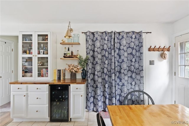 7085 Foxlair Dr, Mechanicsville, VA 23111 - indoor dry bar with beverage cooler and light tile patterned flooring