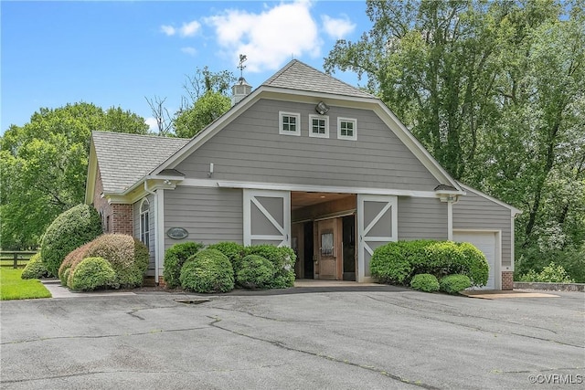3300 Riverglade Rd, Powhatan, VA 23139 - view of front of home with a barn, an outbuilding, brick siding, a chimney, and a shingled roof
