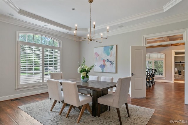 3300 Riverglade Rd, Powhatan, VA 23139 - dining area with a tray ceiling, dark wood-style floors, healthy amount of natural light, a chandelier, and crown molding