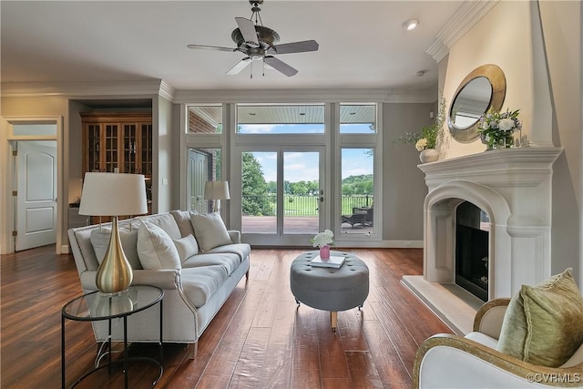 3300 Riverglade Rd, Powhatan, VA 23139 - living room with crown molding, wood-type flooring, a fireplace with raised hearth, and ceiling fan