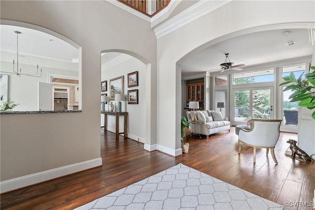 3300 Riverglade Rd, Powhatan, VA 23139 - entrance foyer with ornamental molding, ceiling fan, dark wood-style floors, arched walkways, and a chandelier