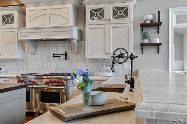 3300 Riverglade Rd, Powhatan, VA 23139 - kitchen with range with two ovens, tasteful backsplash, and premium range hood