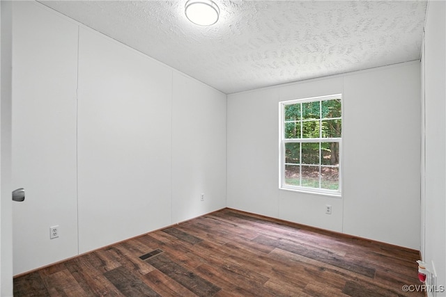 209 Oak Hill Rd, Prospect, VA 23960 - spare room with wood finished floors and a textured ceiling
