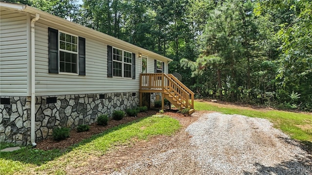 209 Oak Hill Rd, Prospect, VA 23960 - view of front facade with crawl space and view of scattered trees
