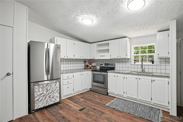 209 Oak Hill Rd, Prospect, VA 23960 - kitchen featuring appliances with stainless steel finishes, dark wood-style flooring, decorative backsplash, a textured ceiling, and white cabinets