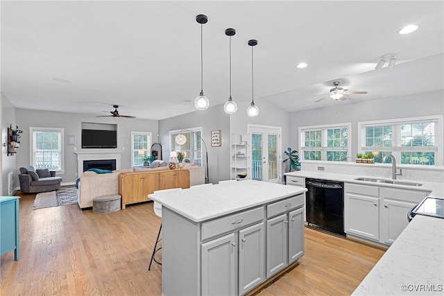 9032 Fascine Ct, Mechanicsville, VA 23116 - kitchen featuring black dishwasher, a ceiling fan, a center island, plenty of natural light, and recessed lighting