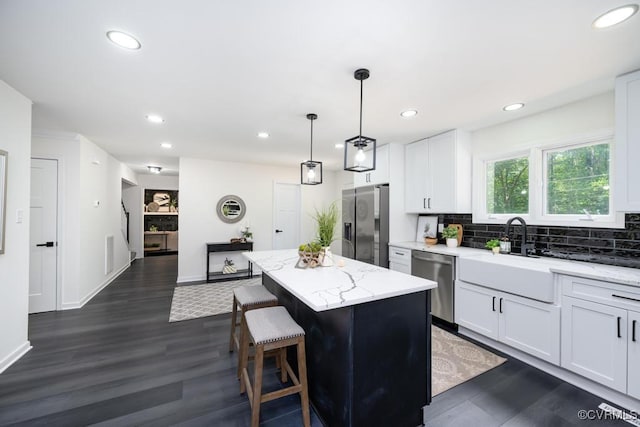 2629 Maidens Rd, Powhatan, VA 23139 - kitchen with stainless steel appliances, a center island, recessed lighting, dark wood-style flooring, and backsplash