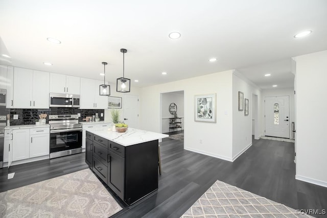 2629 Maidens Rd, Powhatan, VA 23139 - kitchen with stainless steel appliances, dark wood-style floors, white cabinetry, decorative backsplash, and dark cabinetry