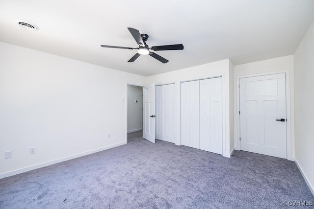 2629 Maidens Rd, Powhatan, VA 23139 - unfurnished bedroom with multiple closets, carpet floors, and a ceiling fan