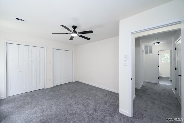 2629 Maidens Rd, Powhatan, VA 23139 - unfurnished bedroom featuring dark colored carpet, two closets, and a ceiling fan