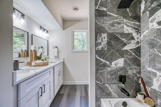 2629 Maidens Rd, Powhatan, VA 23139 - full bath featuring double vanity, healthy amount of natural light, wood finished floors, and tub / shower combination