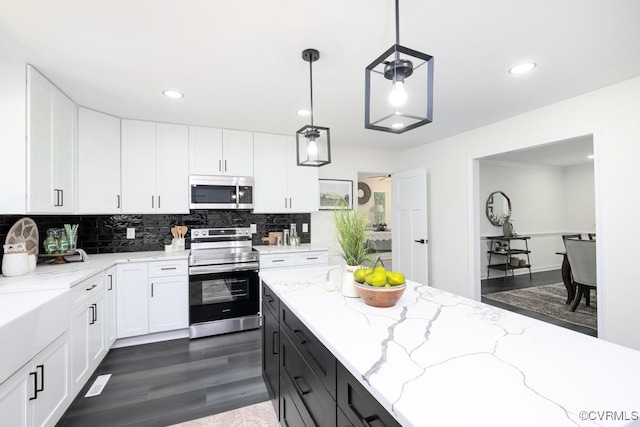 2629 Maidens Rd, Powhatan, VA 23139 - kitchen featuring stainless steel appliances, white cabinets, tasteful backsplash, dark wood-style flooring, and recessed lighting