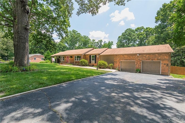 3 Milby Cir, Sandston, VA 23150 - ranch-style home with a garage, driveway, and brick siding