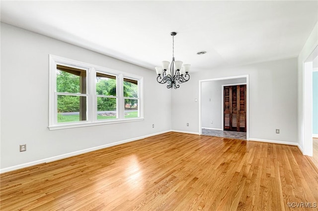 3 Milby Cir, Sandston, VA 23150 - spare room featuring a chandelier and light wood-type flooring