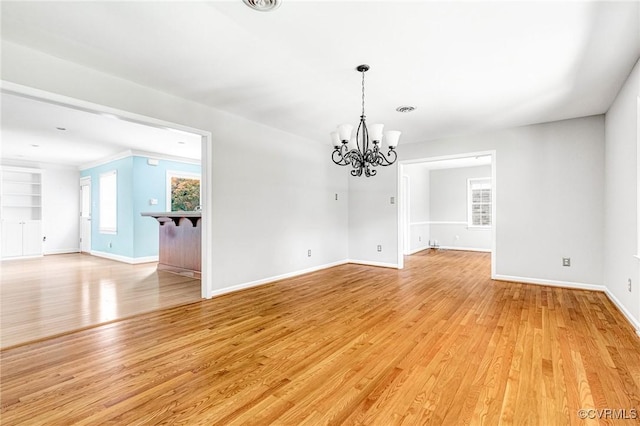 3 Milby Cir, Sandston, VA 23150 - empty room featuring a chandelier and light wood finished floors