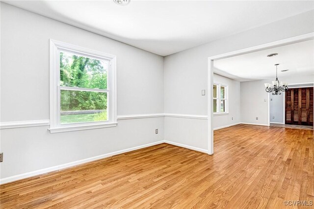 3 Milby Cir, Sandston, VA 23150 - spare room featuring a chandelier and light wood-type flooring