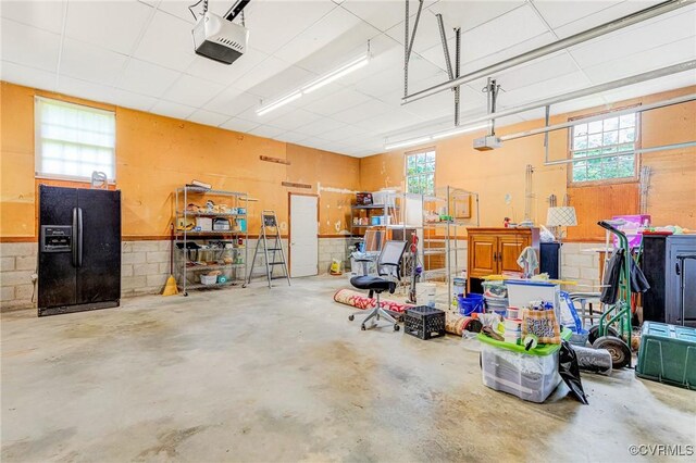3 Milby Cir, Sandston, VA 23150 - garage featuring black fridge and a garage door opener