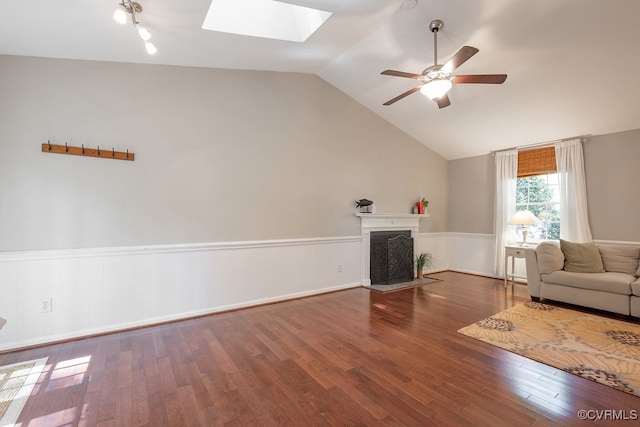 2713 Brookforest Rd, Midlothian, VA 23112 - living area with a skylight, ceiling fan, lofted ceiling, wood finished floors, and a fireplace with flush hearth