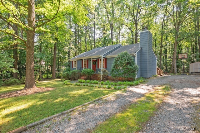 2713 Brookforest Rd, Midlothian, VA 23112 - view of front of home with a storage shed, a chimney, driveway, and a front yard