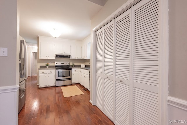 2713 Brookforest Rd, Midlothian, VA 23112 - kitchen with appliances with stainless steel finishes, under cabinet range hood, white cabinetry, dark countertops, and dark wood-style flooring