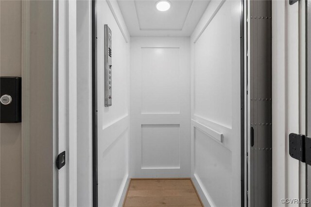 12340 Purbrook Walk, Henrico, VA 23233 - hall with elevator and light wood finished floors
