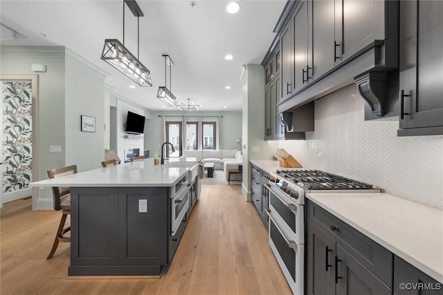 12340 Purbrook Walk, Henrico, VA 23233 - kitchen featuring double oven range, open floor plan, light countertops, tasteful backsplash, and a breakfast bar area