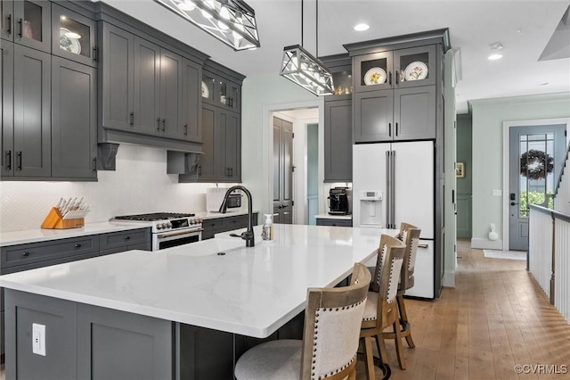 12340 Purbrook Walk, Henrico, VA 23233 - kitchen with premium appliances, gray cabinetry, a center island with sink, light countertops, and recessed lighting