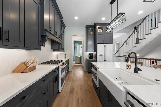 12340 Purbrook Walk, Henrico, VA 23233 - kitchen featuring white appliances, tasteful backsplash, light countertops, wood-type flooring, and recessed lighting
