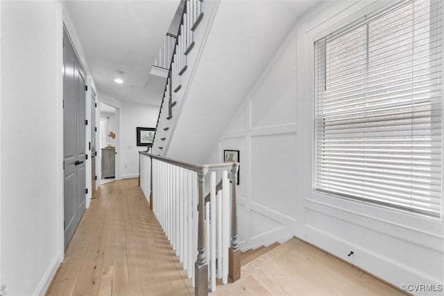 12340 Purbrook Walk, Henrico, VA 23233 - hall with light wood-style flooring, recessed lighting, a decorative wall, and an upstairs landing