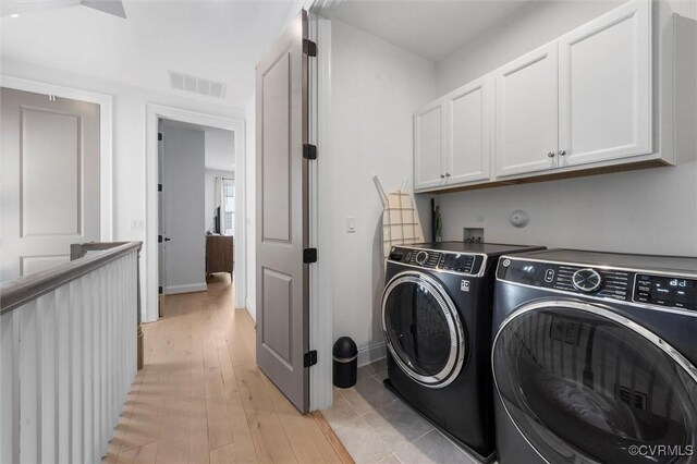 12340 Purbrook Walk, Henrico, VA 23233 - washroom featuring cabinet space, separate washer and dryer, and light wood-style flooring