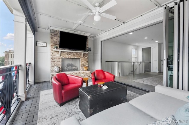 12340 Purbrook Walk, Henrico, VA 23233 - living room with a stone fireplace, ceiling fan, and recessed lighting