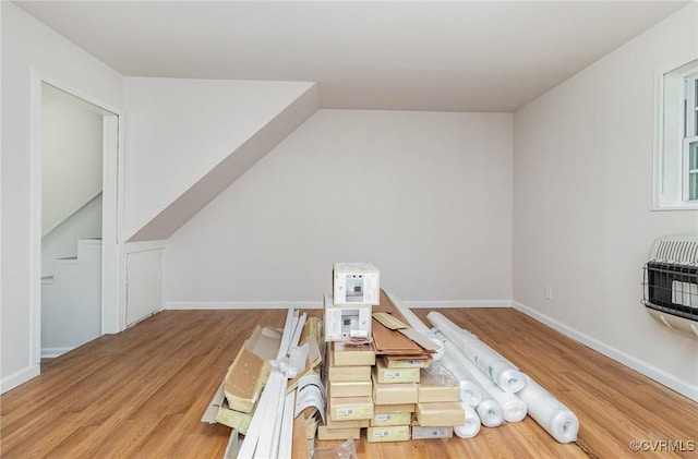 24 Hummingbird Ln, Cumberland, VA 23040 - playroom featuring wood finished floors, heating unit, and vaulted ceiling