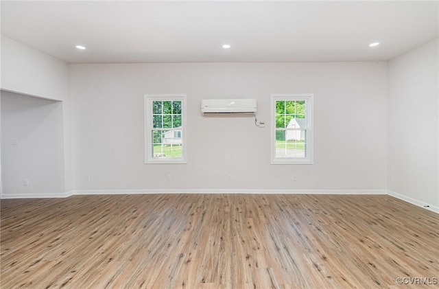 24 Hummingbird Ln, Cumberland, VA 23040 - empty room with an AC wall unit, wood finished floors, and recessed lighting