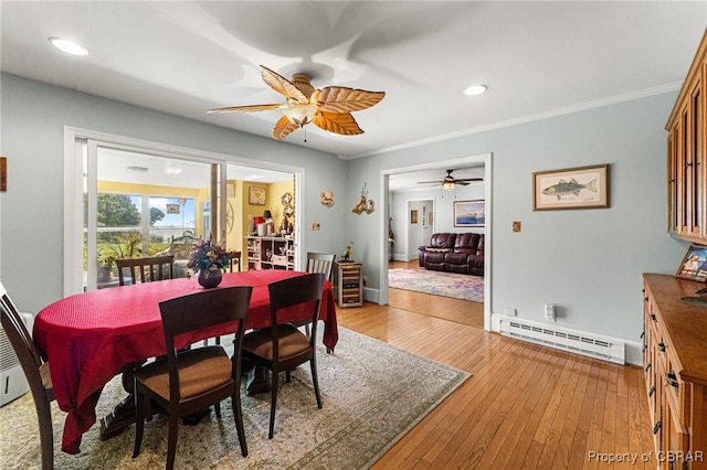 77 Kent Cove Rd, Kilmarnock, VA 22482 - dining room with a baseboard radiator, ceiling fan, light wood finished floors, recessed lighting, and ornamental molding