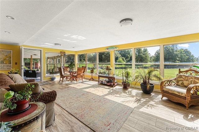 77 Kent Cove Rd, Kilmarnock, VA 22482 - sunroom with healthy amount of natural light and a textured ceiling