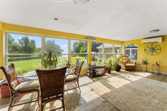77 Kent Cove Rd, Kilmarnock, VA 22482 - sunroom featuring a wall unit AC and wood finished floors
