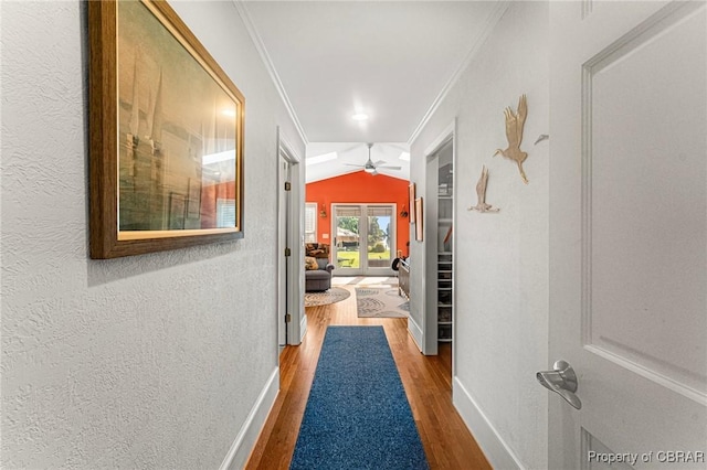 77 Kent Cove Rd, Kilmarnock, VA 22482 - hallway with wood finished floors, crown molding, a textured wall, and vaulted ceiling