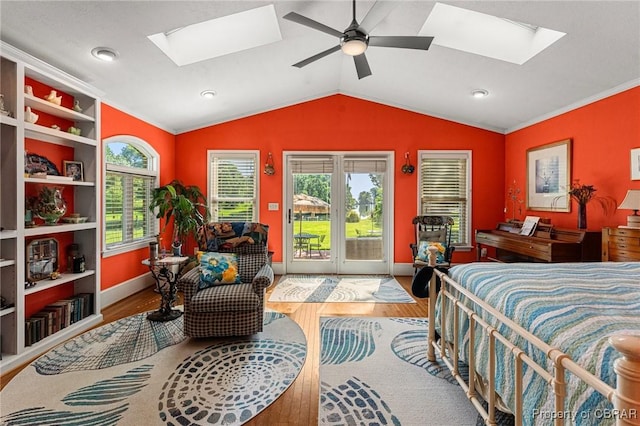 77 Kent Cove Rd, Kilmarnock, VA 22482 - bedroom with a skylight, wood finished floors, access to exterior, lofted ceiling, and ornamental molding