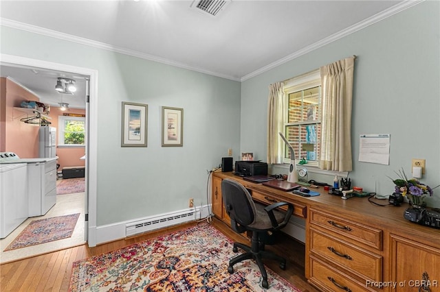 77 Kent Cove Rd, Kilmarnock, VA 22482 - office space with baseboard heating, washer and dryer, ornamental molding, and hardwood / wood-style floors