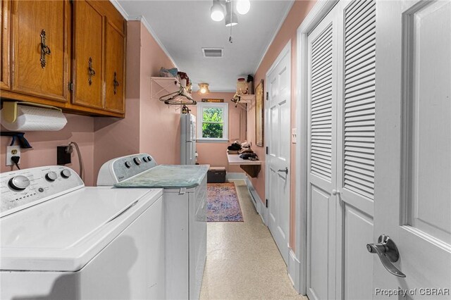 77 Kent Cove Rd, Kilmarnock, VA 22482 - laundry area featuring cabinet space and washing machine and clothes dryer