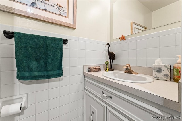 77 Kent Cove Rd, Kilmarnock, VA 22482 - bathroom with vanity, tile walls, and tasteful backsplash