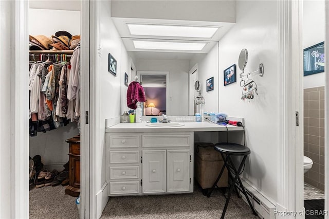 77 Kent Cove Rd, Kilmarnock, VA 22482 - bathroom with vanity and a walk in closet
