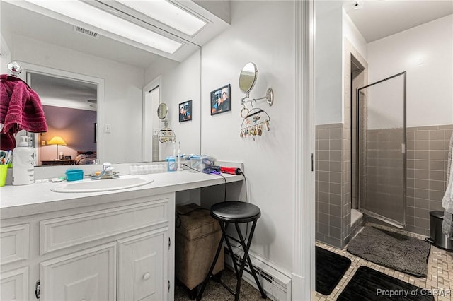 77 Kent Cove Rd, Kilmarnock, VA 22482 - ensuite bathroom with a stall shower, vanity, and tile patterned flooring