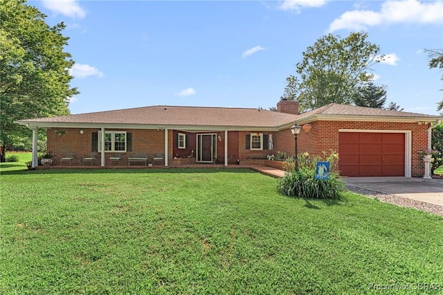 77 Kent Cove Rd, Kilmarnock, VA 22482 - single story home featuring an attached garage, asphalt driveway, a front lawn, a chimney, and brick siding