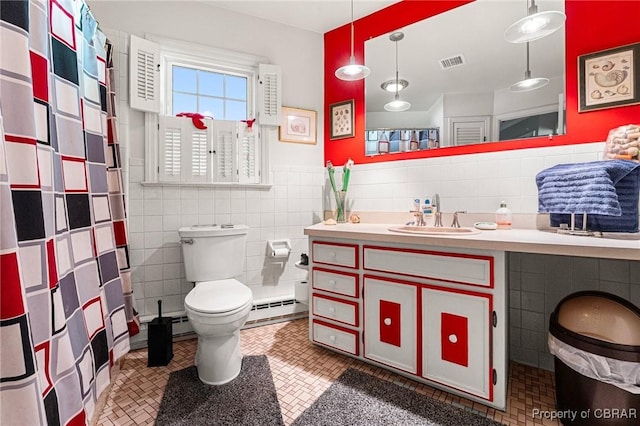 77 Kent Cove Rd, Kilmarnock, VA 22482 - full bathroom featuring tile walls, vanity, a baseboard heating unit, a shower with shower curtain, and wainscoting