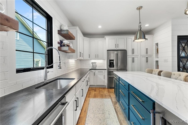 3719 Waverton Dr, Midlothian, VA 23112 - kitchen featuring blue cabinets, stainless steel refrigerator with ice dispenser, open shelves, white cabinetry, and light wood-style flooring