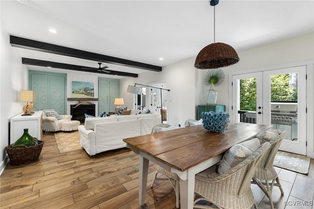 3719 Waverton Dr, Midlothian, VA 23112 - dining space featuring beam ceiling, a ceiling fan, french doors, light wood-style flooring, and a fireplace