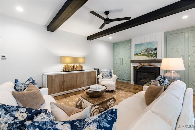 3719 Waverton Dr, Midlothian, VA 23112 - living area with wood finished floors, ceiling fan, beamed ceiling, a glass covered fireplace, and recessed lighting