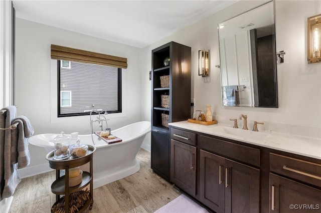 3719 Waverton Dr, Midlothian, VA 23112 - full bathroom featuring wood finished floors, a soaking tub, and vanity