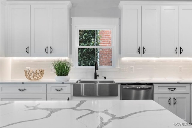 208 Minor St, Richmond, VA 23222 - kitchen featuring stainless steel dishwasher, white cabinets, backsplash, and light stone counters